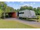Exterior view of home showing an RV, shed, and storage container in the back yard at 4911 Chisolm Rd, Johns Island, SC 29455