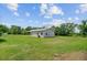 Exterior view of home and surrounding green space at 4911 Chisolm Rd, Johns Island, SC 29455