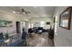 Open-concept living room with recessed lights, ceiling fan, modern decor, and wood flooring at 4911 Chisolm Rd, Johns Island, SC 29455