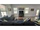 Spacious living area with modern decor, wood-look flooring, natural lighting, and open design at 4911 Chisolm Rd, Johns Island, SC 29455