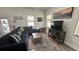 Cozy living room featuring natural light, modern decor, comfortable seating, and wood flooring at 4911 Chisolm Rd, Johns Island, SC 29455