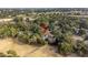 This aerial view shows the lush, green landscape and residential neighborhood near the golf course at 507 Cobby Creek Ln, Seabrook Island, SC 29455