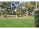 Sprawling lawn with mature trees and shrubs leading to the property at 507 Cobby Creek Ln, Seabrook Island, SC 29455