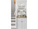 Built in bar area with glassware display and marble countertop at 507 Cobby Creek Ln, Seabrook Island, SC 29455
