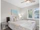 Serene bedroom featuring a queen bed, a ceiling fan, and natural light from the window at 507 Cobby Creek Ln, Seabrook Island, SC 29455