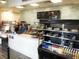 Charming cafe featuring a counter with smiling employee, pastries, cakes and beverage selections at 507 Cobby Creek Ln, Seabrook Island, SC 29455
