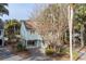Stilt home with driveway surrounded by trees and landscaping at 507 Cobby Creek Ln, Seabrook Island, SC 29455