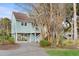 Exterior of coastal home with ground-level garage and covered parking area at 507 Cobby Creek Ln, Seabrook Island, SC 29455