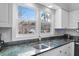 Bright kitchen featuring granite countertops, double sink, and a window offering exterior views at 507 Cobby Creek Ln, Seabrook Island, SC 29455