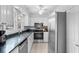 Modern kitchen features stainless steel appliances, granite countertops and white cabinets at 507 Cobby Creek Ln, Seabrook Island, SC 29455