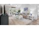 Bright living room features wood plank accent wall, modern furniture and neutral colors throughout at 507 Cobby Creek Ln, Seabrook Island, SC 29455