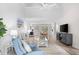 Open-concept living room leading to sun room and kitchen at 507 Cobby Creek Ln, Seabrook Island, SC 29455