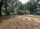 Large backyard with trees and another home nearby at 5626 Shelton St, North Charleston, SC 29406