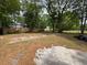 Spacious backyard with trees and leaves at 5626 Shelton St, North Charleston, SC 29406