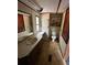 Bathroom featuring a vanity, toilet, and open shelving, with a window providing natural light at 5626 Shelton St, North Charleston, SC 29406