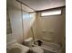 Bathroom with a toilet, and a bathtub with shower, showcasing the essential amenities at 5626 Shelton St, North Charleston, SC 29406