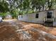 Side exterior view of a single-wide mobile home showing door access at 5626 Shelton St, North Charleston, SC 29406