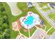 Aerial view of the community pool area with ample seating, landscaping, and parking spaces at 575 Red Monarch Way, Moncks Corner, SC 29461
