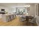 Open-concept living area with modern kitchen, dining space, and comfortable seating at 575 Red Monarch Way, Moncks Corner, SC 29461