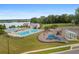 An aerial view of a community pool, playground, picnic shelter, and lake at 589 Crossland Dr, Moncks Corner, SC 29461