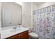 Bright bathroom with a dragonfly shower curtain, a vanity with a modern sink, and white walls at 589 Crossland Dr, Moncks Corner, SC 29461