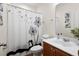Well-lit bathroom featuring a stylish shower curtain, neutral paint, and clean vanity at 589 Crossland Dr, Moncks Corner, SC 29461