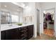 Bathroom featuring double sinks, granite countertop and an open walk-in closet at 589 Crossland Dr, Moncks Corner, SC 29461