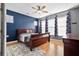 Cozy bedroom featuring a ceiling fan, natural light, and wood flooring at 589 Crossland Dr, Moncks Corner, SC 29461
