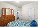 Cozy bedroom featuring a large dresser, patterned bedding, and bright natural light at 589 Crossland Dr, Moncks Corner, SC 29461
