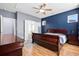 Primary bedroom with a ceiling fan, natural light, and wood flooring at 589 Crossland Dr, Moncks Corner, SC 29461