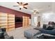 Spacious bonus room with built-in shelves, ceiling fans, and neutral carpeting at 589 Crossland Dr, Moncks Corner, SC 29461