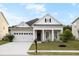 Charming single-story home with a well-manicured lawn and covered porch at 589 Crossland Dr, Moncks Corner, SC 29461