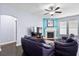 Comfortable living room with a fireplace and ample natural light at 589 Crossland Dr, Moncks Corner, SC 29461