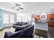 Open-concept living room with kitchen view and plenty of space for entertaining at 589 Crossland Dr, Moncks Corner, SC 29461