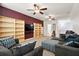 A spacious living area features built-in shelves, a TV, and comfortable seating arrangements for relaxation and entertainment at 589 Crossland Dr, Moncks Corner, SC 29461