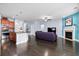 Bright open-concept living room featuring kitchen and fireplace at 589 Crossland Dr, Moncks Corner, SC 29461