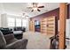Inviting living room with comfortable seating, ceiling fans, built-in shelves, and a purple accent wall at 589 Crossland Dr, Moncks Corner, SC 29461