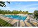 Community pool with lounge chairs, palm trees, and well-kept grounds at 589 Crossland Dr, Moncks Corner, SC 29461