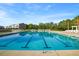 Community swimming pool with blue water, lounge chairs, and meticulously maintained landscaping at 589 Crossland Dr, Moncks Corner, SC 29461