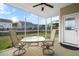 Inviting screened porch with seating area, offering a peaceful backyard view at 589 Crossland Dr, Moncks Corner, SC 29461