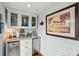 Stylish bar area featuring custom cabinets, granite countertops, and beverage coolers, perfect for entertaining at 62 Gadsden St # A, Charleston, SC 29401