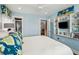 Relaxing bedroom with light blue walls, an en-suite bath, and spiral stairs, creating a peaceful retreat at 62 Gadsden St # A, Charleston, SC 29401
