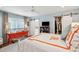 A well-lit bedroom with a large window, orange dresser, and sliding barn door closet at 62 Gadsden St # A, Charleston, SC 29401