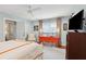 Bright bedroom featuring a window and chair, complete with modern amenities and a soothing color palette at 62 Gadsden St # A, Charleston, SC 29401