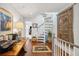 Bright entryway featuring a unique spiral staircase and detailed decor, adding character to the home's interior at 62 Gadsden St # A, Charleston, SC 29401