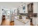 Bright, open kitchen with stainless steel appliances, granite countertops, and hardwood floors at 62 Gadsden St # A, Charleston, SC 29401