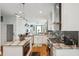 Bright, open kitchen with stainless steel appliances, granite countertops, and hardwood floors at 62 Gadsden St # A, Charleston, SC 29401