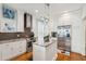 Modern kitchen with granite countertops, stainless steel appliances, island and tile backsplash at 62 Gadsden St # A, Charleston, SC 29401