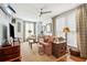 Cozy living room with comfortable seating, ceiling fan, and natural light at 62 Gadsden St # A, Charleston, SC 29401