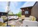 Stylish rooftop patio featuring comfortable seating, an umbrella, and city views, creating an inviting outdoor space at 62 Gadsden St # A, Charleston, SC 29401